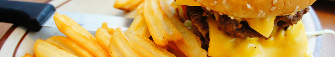 Eating Burger Hot Dog at Famous Uncle Al's Hotdogs restaurant in Virginia Beach, VA.